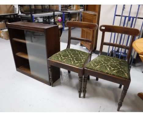 A pair of antique dining chairs on turned legs, together with a mid twentieth century sliding glass door bookcase and an oak 