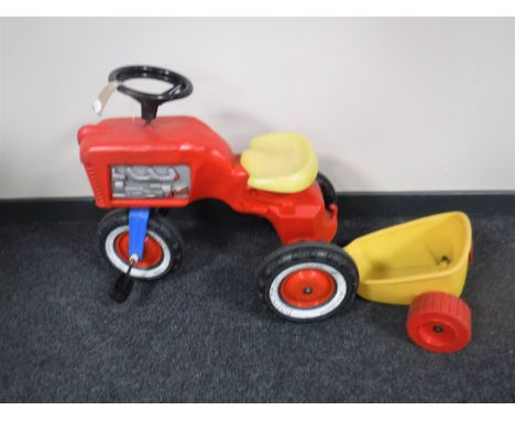 A vintage Rolly toys tractor with trailer 