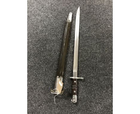 A Remington bayonet in scabbard dated 1913