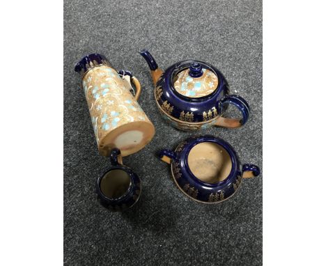 A four piece Royal Doulton Lambeth tea service 