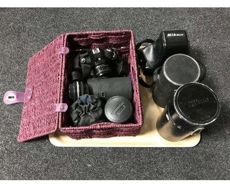 A tray of Nikon F-301 camera with lens in case, basket of Nikon Em camera, six assorted lenses