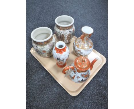 A tray of five pieces of 20th century Japanese porcelain comprising four vases and a teapot 