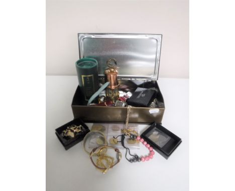 A box of costume jewellery, wrist watches, Spanish coins, miniature brass miners lamp