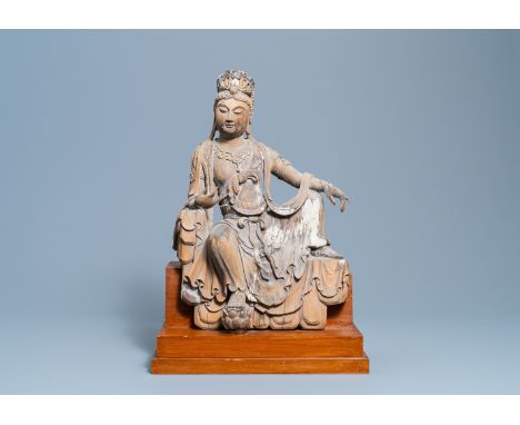 A Chinese painted wooden figure of Guanyin, MingH.: 63,5 cm (with stand)Ê Provenance: The collection of a French envoy in Chi