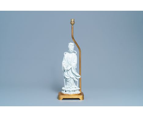 A Chinese gilt bronze lamp-mounted blanc de Chine figure of Guanyin, 19/20th C.H.: 58 cm (the whole) H.: 38 cm (the figure)