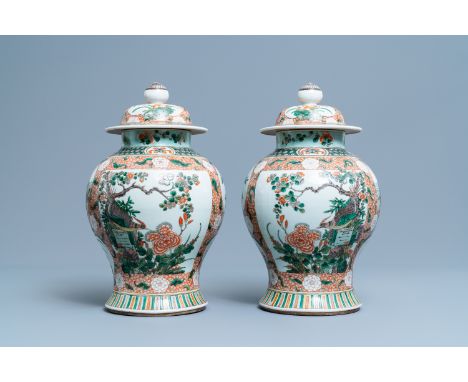 A pair of Chinese famille verte vases and covers, Kangxi mark, 19th C.H.: 40,5 cm