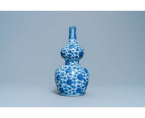 A Chinese blue and white 'lotus scroll' double gourd vase, WanliH.: 32,5 cm