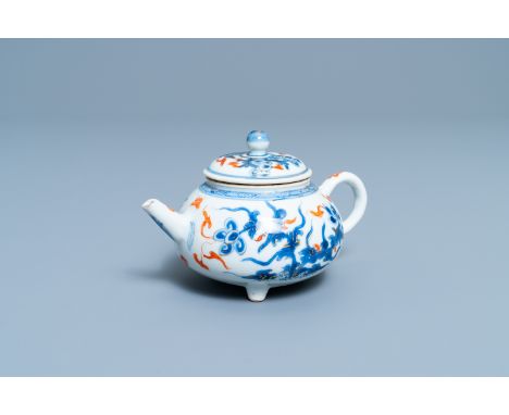 A rare Chinese blue, white, iron red and gilt tripod teapot and cover, KangxiL.: 15 cm - H.: 9 cm