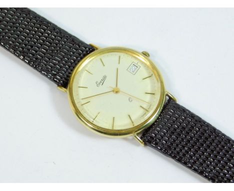 GOLD WATCH. A gentleman's 9ct. gold cased Everite wristwatch, the dial with baton numerals, date aperture & sweep seconds han