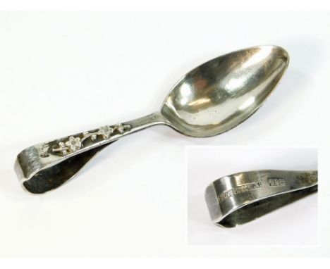 CHINESE SPOON. A Chinese silver spoon by Win On Co., Hong King. The folded stem with applied flower stem, beneath initials.  