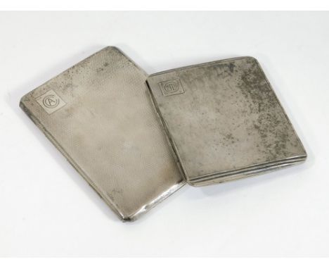 CIGARETTE CASES. Two engine turned silver cigarette cases. Both Birmingham 1944. Total weight approx. 314g. (10 t.oz.).  Plea