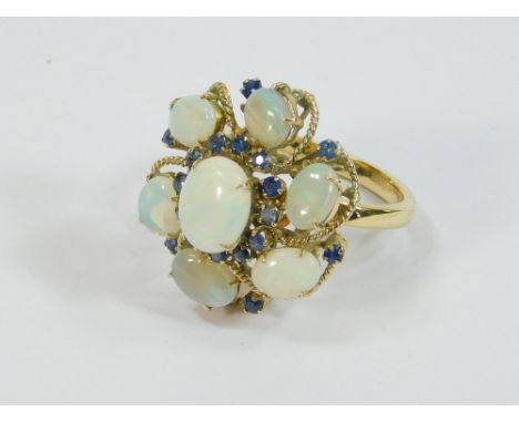 OPAL RING. An 18ct. gold opal &amp; sapphire cocktail ring, the top approx. 2.5 x 2.2cm. Size R. Approx. 8.1g.