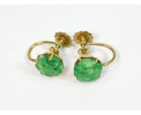 JADE EARRINGS. A pair of Chinese carved & pierced jade earrings set in 9ct. gold & with 9ct. gold screw fittings.  Please not