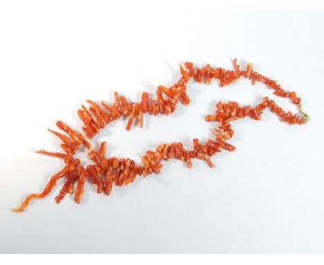 CORAL. A natural stick coral necklace.  Please note that all items in this auction are previously owned & are offered on beha