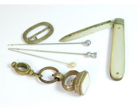 FRUIT KNIFE ETC. A mother of pearl fruit knife with EPNS blade, a silver buckle (a.f.), a 19th century seal fob etc.  Please 