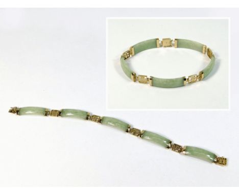 CHINESE JADE. A Chinese 9k. gold curved jade bracelet.  Please note that all items in this auction are previously owned & are