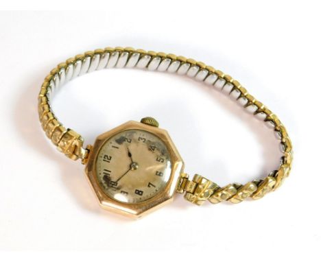 ROLEX WATCH. A lady's 1920's 9ct. gold cased Rolex wristwatch with engine turned silvered dial. The cover stamped Rolex, 1117