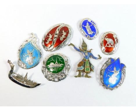 SIAM SILVER. A Siam silver gilt & enamel dancing girl brooch, six Siam coloured enamel brooches etc.  Please note that all it