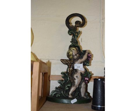 Cast iron cherub formed candlestick