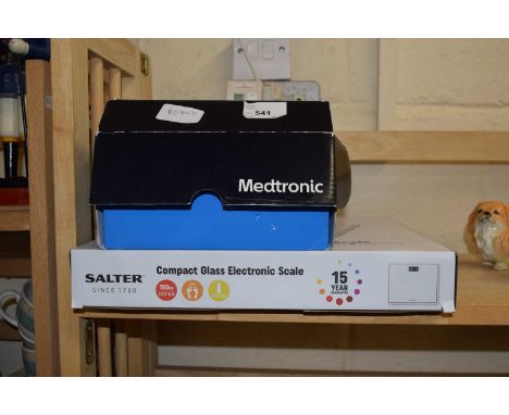 Compact glass electronic scale together with a Medtronic cardiac monitor