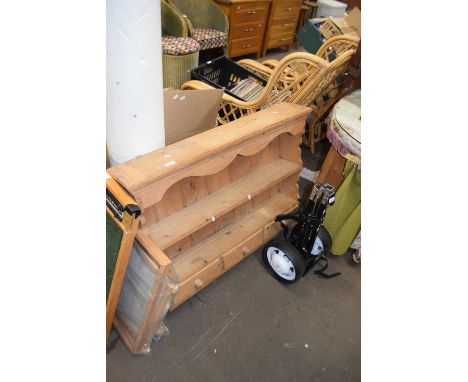 A modern pine wall shelf with drawers