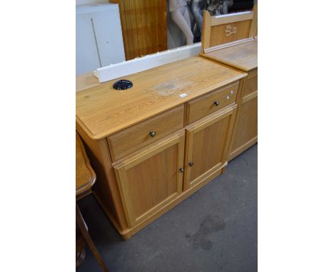 A modern light oak sideboard