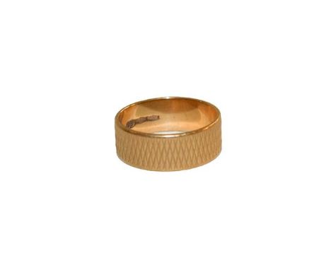 A texture band ring, stamped '750', finger size O.  Gross weight 5.1 grams. 