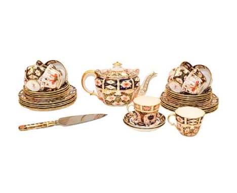 A Royal Crown Derby part tea and coffee service decorated in the Old Imari pattern, comprising a teapot, two bread and butter