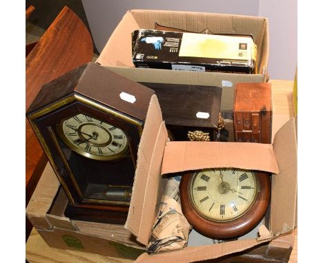 A selection of clocks including striking mantel clocks, three chiming mantel clocks, a black metal striking mantel clock, two