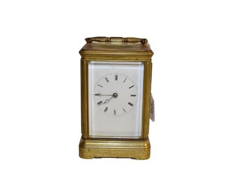 A brass striking carriage clock, movement striking on a bell, movement backplate stamped Japy Freres, later platform lever es