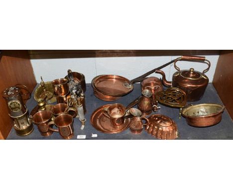 A quantity of mainly 19th century copper and brass including tankards, trivet, kettle, jelly mould, and an Eccles type SL min