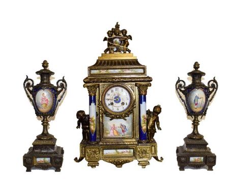 A French gilt metal and porcelain mounted striking mantel clock garniture circa. 1890