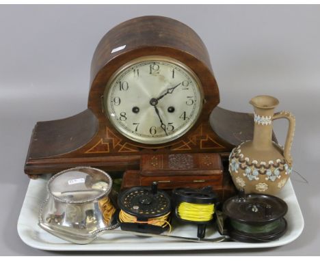A tray of collectables to include mantel clock, fishing reels, Doulton ewer, etc.