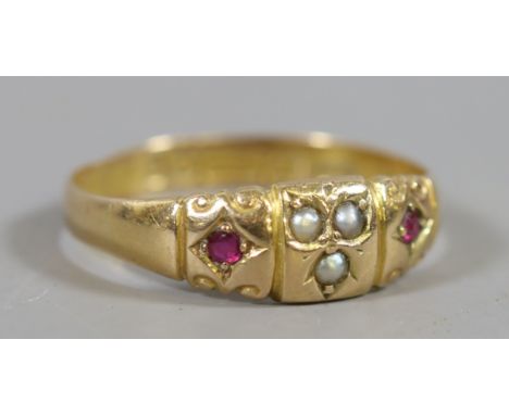 An Edwardian 15 carat gold seed pearl and ruby ring assayed Birmingham 1905, size P.5.