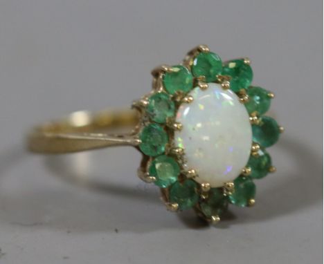 A ladies 9 carat gold opal and emerald dress ring 1.97 grams, UK size O.5.