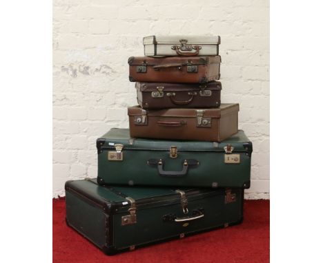 Six old vintage suitcases assorted sizes.