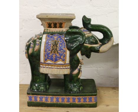 A large glazed ceramic garden seat modelled as an Indian elephant.