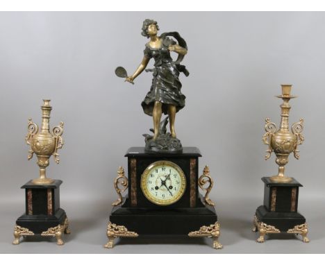 A Victorian slate figural mantel clock garniture with gilt metal mounts and enamel dial.