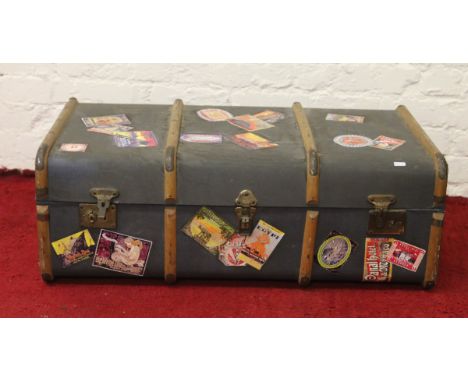 A students vintage wooden bound travel trunk.