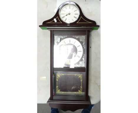 Two modern quartz clock. One wall hanging other with a wooden mantle clock 