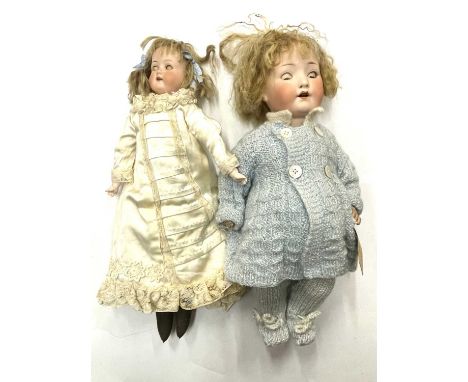 A pair of Heubach Koppelsdorf bisque head dolls, to include: - Open-mouthed, marked 275.76/o to nape - Open-mouthed, with mov