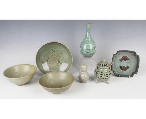 A small group of South-east Asian celadon-glazed pottery, including two Chinese circular bowls, diameters 16.6cm and 17cm, a 