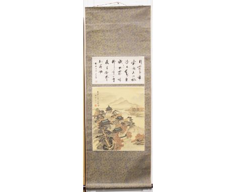 A Chinese hanging scroll painting, 20th century, depicting a pavilion complex in a coastal landscape, two lines of black text