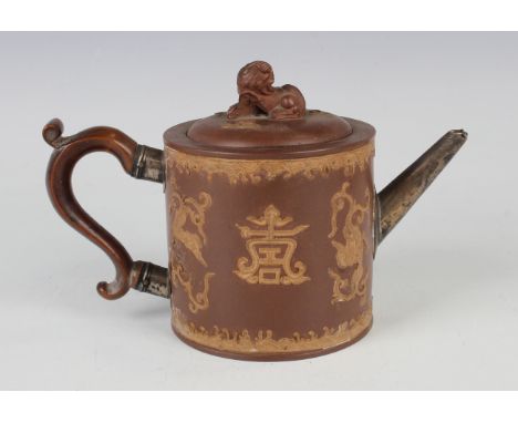 A Chinese Yixing stoneware teapot and cover, Qing dynasty, probably late 18th century, the cylindrical body applied with buff