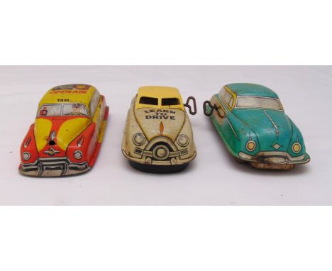 Three vintage litho tin plate toy cars, to include wind up car no 1 learn to drive, friction Taxi no 39 and wind up woody, al
