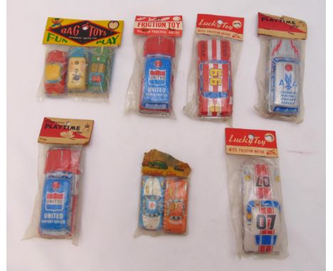 Seven packs of vintage litho tin plate friction cars to include Lucky Toy, Playtime and Bag of Toys all in original packaging