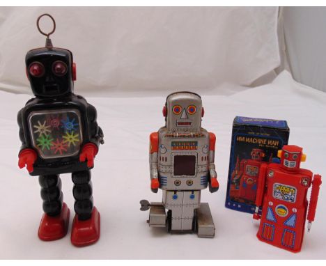 Three vintage litho clockwork tin plate Robots made in Japan to include Masudaya Mini Machine Man in original packaging