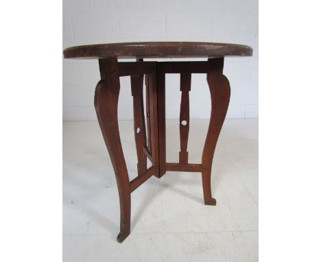 Carved Indian table depicting 'See no Evil, Speak no Evil, Hear no Evil' on folding tripod base