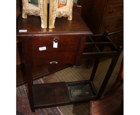 A PROBABLE EDWARDIAN OAK FINISHED STICK STAND with insert drip tray, having fall-down front glove compartment 