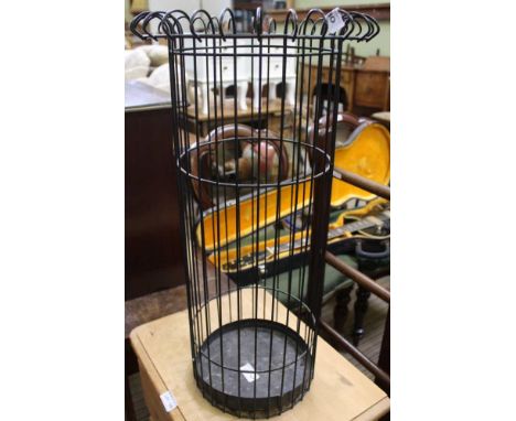 A WIREWORK STICK STAND with drip tray 